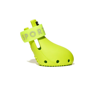 Bright green dog shoe with 'SPORT' label on a white background